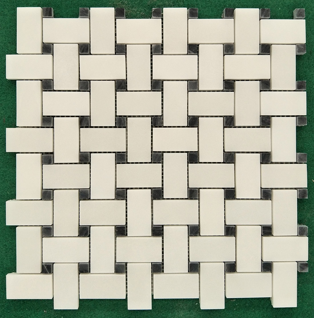 white and black mosaic tiles of natural marble